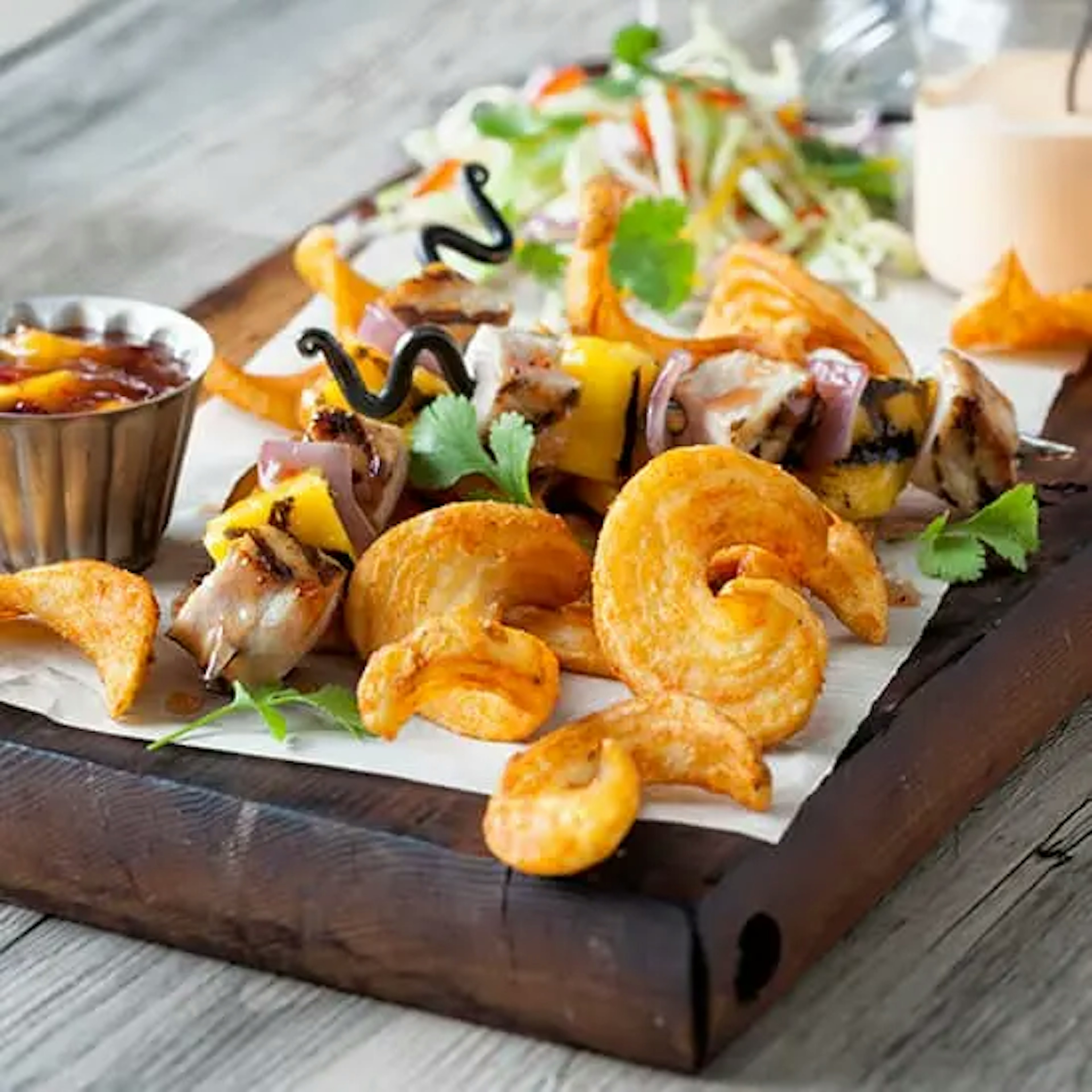 Pork Tenderloin Mango Skewers with SeasonedCrisp JR Buffalos SIDEWINDERS™ Fried Potatoes