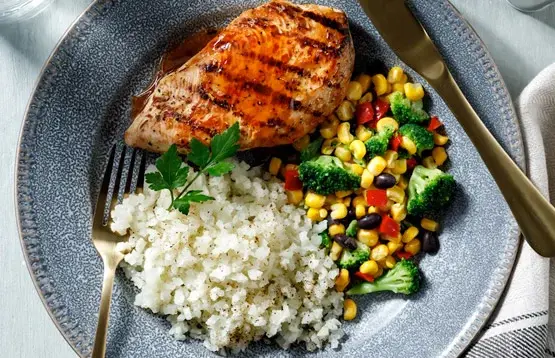 Simplot Simple Goodness™ Premium Vegetables Riced Cauliflower on plate with chicken